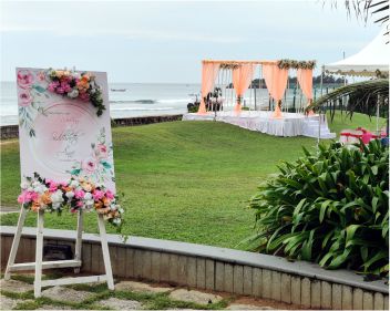 beach wedding radisson blu temple bay name board stage